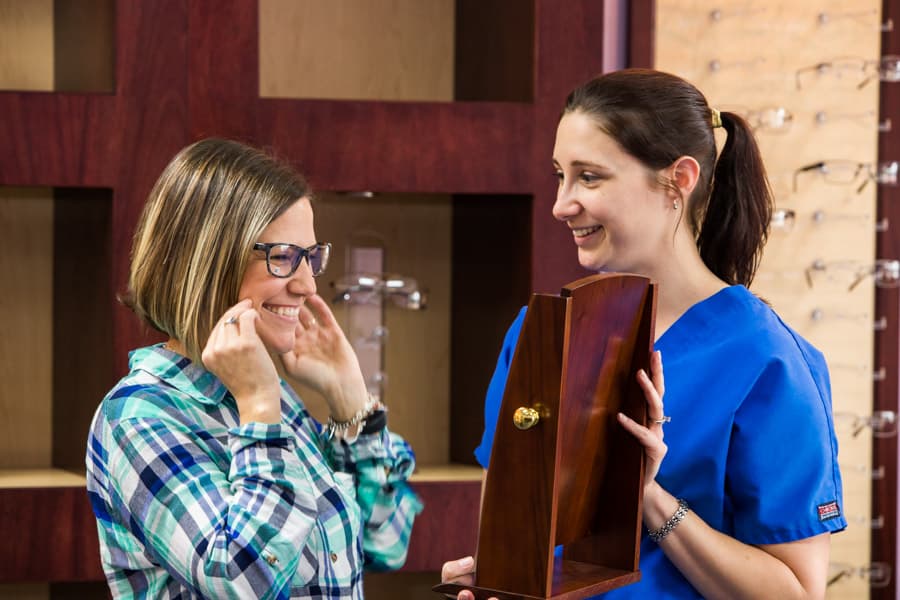Woman trying on glasses